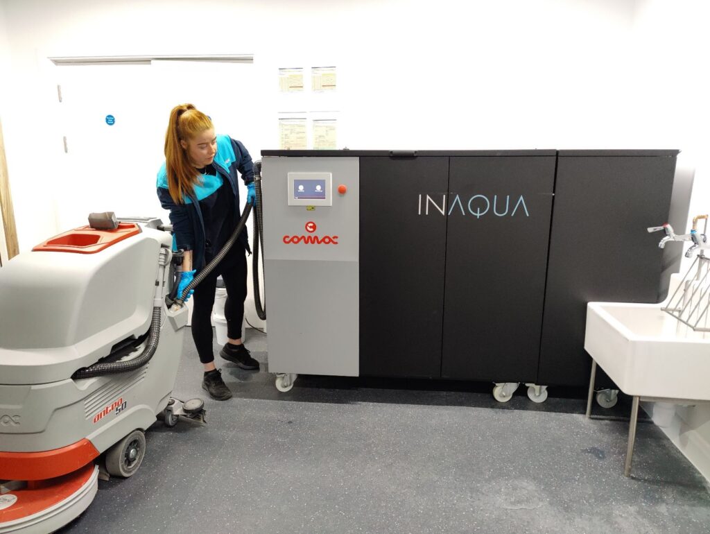 Bidvest Noonan cleaning operative using a Comac Inaqua machine