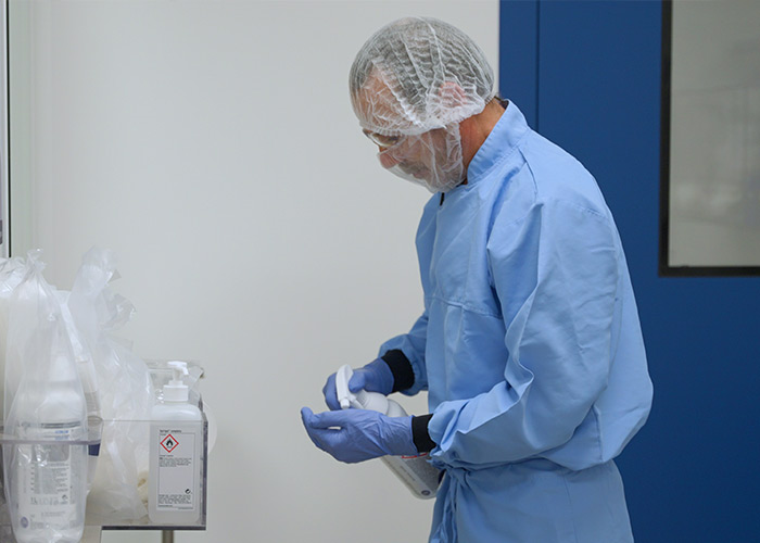 Cleanroom operative using protective equipment